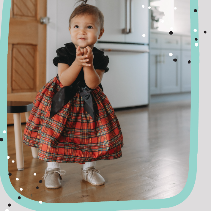 toddler girl wearing christmas dress